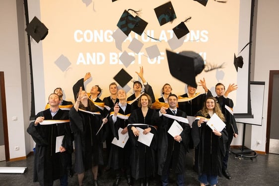 Advanced Master in Biotech and Medtech Ventures student from Solvay Brussels School - Lifelong Learning are celebrated their graduation by throwing their hats.